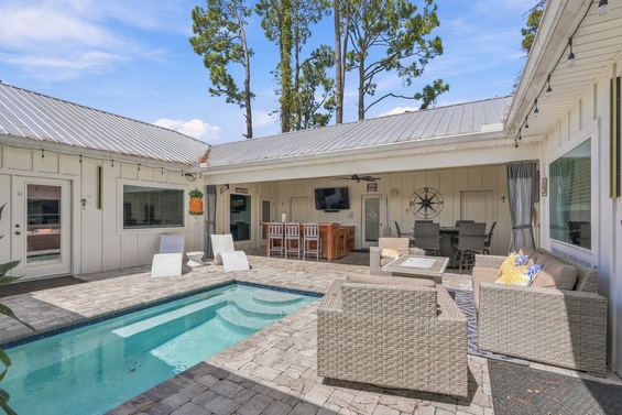 Your private oasis awaits in this sun-filled courtyard. Lounge poolside, gather around the outdoor dining table, or unwind in the shaded seating area—all within your own secluded retreat.