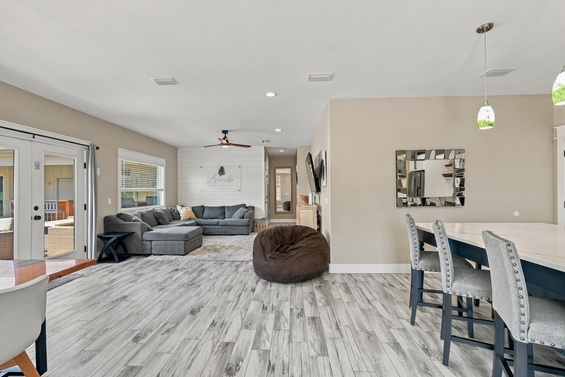 Step into your spacious open-concept living and dining area, where soft neutral tones and modern finishes create a bright, welcoming retreat. Relax on the cozy sectional or gather around the elegant dining table—your perfect home base.