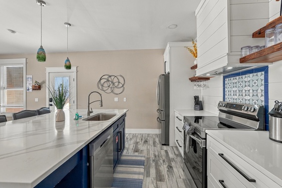 Step into your bright, beautifully designed kitchen, where a spacious island invites you to gather, cook, and create memories. Modern appliances and coastal-inspired touches make every moment feel effortless.