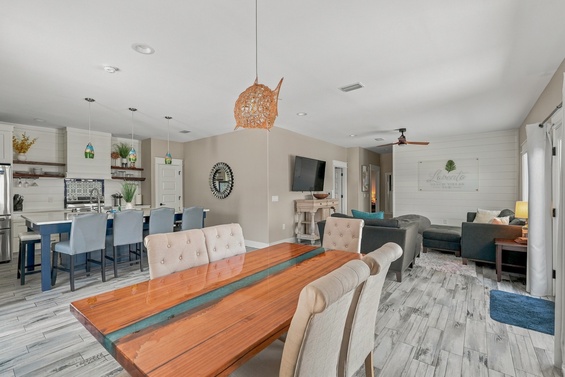 Gather around this stunning live-edge dining table, where coastal charm meets modern comfort. Your open-concept haven invites you to cook, dine, and unwind all in one beautiful flow.