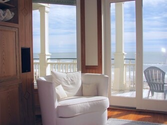 Curl up in your cozy armchair and let ocean waves become your soundtrack. Floor-to-ceiling doors frame endless water views, inviting you to step onto your private balcony whenever you need fresh sea air.