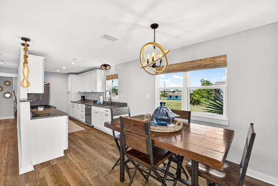 Gather around this beautiful dining table where your family meals become memories, with the modern kitchen at your fingertips and warm natural light pouring in.