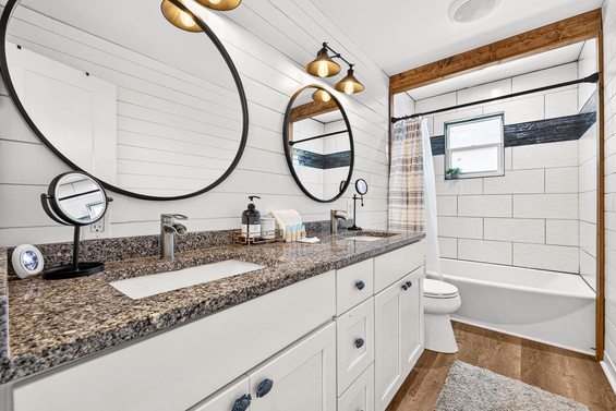 Step into your beautifully designed bathroom with dual sinks, a relaxing tub-shower combo, and warm farmhouse-style finishes that make every morning feel special.