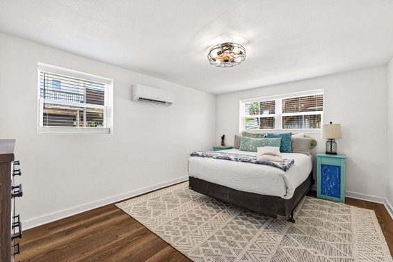 Settle into your serene bedroom where soft natural light, coastal décor, and a plush bed create the perfect retreat for restful nights.