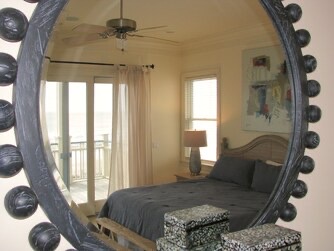 Slip into soft sheets in your stylish bedroom, where natural light streams through balcony doors and a ceiling fan keeps you cool and comfortable all night long.
