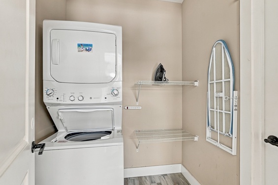Your laundry stays simple with this in-unit washer and dryer combo, plus a handy ironing board and shelves to keep everything organized.