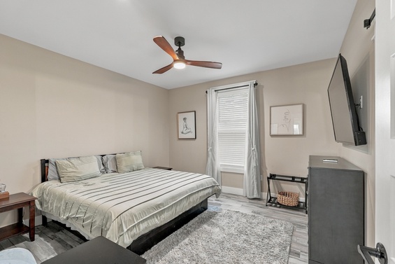 Step into your serene bedroom, where soft neutral tones and plush carpeting create a peaceful retreat. A gentle ceiling fan ensures your comfort year-round.