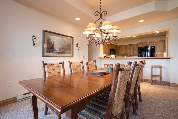 Gather around the spacious dining table, perfect for memorable meals with friends and family. The open kitchen invites easy entertaining and conversation.