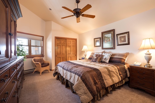 Sink into plush bedding and unwind in your peaceful retreat, where warm wood tones and soft lighting create the perfect ambiance for restful nights.