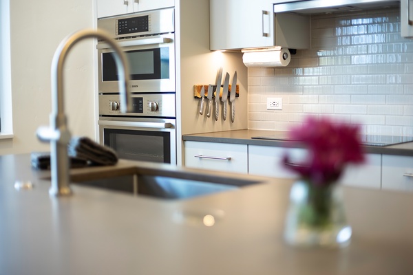 Your gourmet kitchen awaits, featuring sleek modern appliances, bright tile backsplash, and every tool you need to prepare memorable meals during your stay.