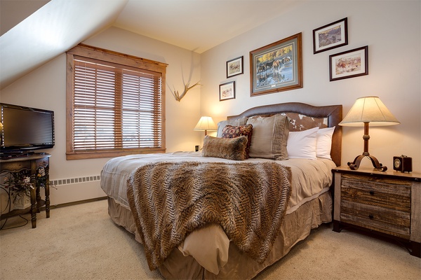 Sink into plush textures and warm Western charm in your cozy retreat. Soft lighting and rustic details create the perfect atmosphere for restful mountain nights.
