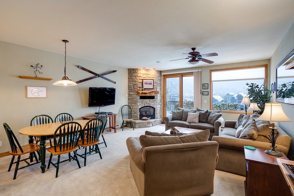 Relax in your cozy living space with a stunning stone fireplace, mountain views, and everything you need to unwind after a day of adventure.