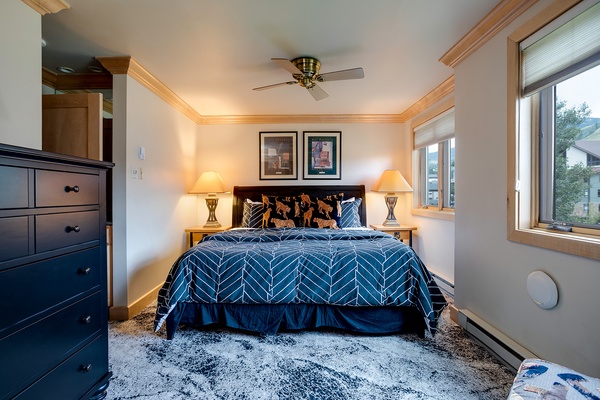 Wake up refreshed in your cozy bedroom, where plush bedding and mountain views create the perfect alpine retreat. Natural light streams through large windows, welcoming each new day.
