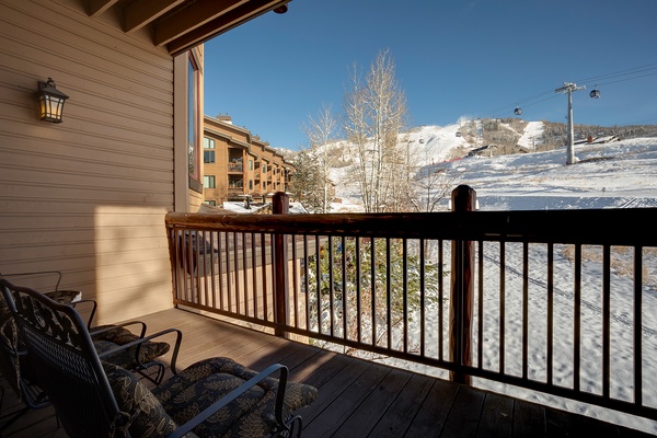 Balcony with direct views of snow-covered slopes and ski lift access—perfect for watching the mountain come alive each morning or unwinding after a day on the slopes.