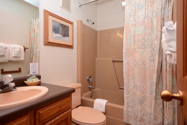 Step into your private bathroom, complete with a full tub-shower combo, fresh towels, and all the essentials you need to feel at home.