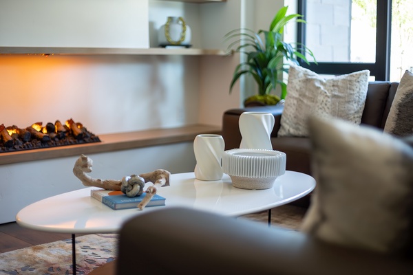 Curl up on the plush sofa with your favorite book while the warm fireplace crackles beside you, creating the perfect retreat after a day of exploring.