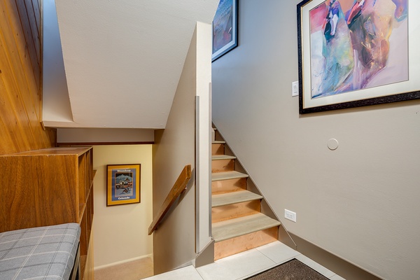 Bright and welcoming multi-level layout with warm wood accents and colorful art that adds character to your mountain retreat.