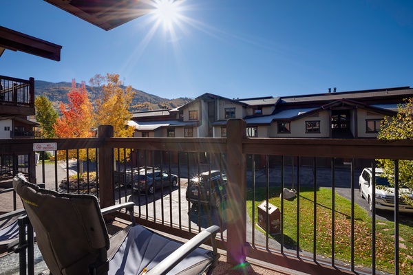 The property is situated in a scenic mountain area with vibrant autumn foliage, offering convenient parking and access to the surrounding neighbourhood during the fall season.