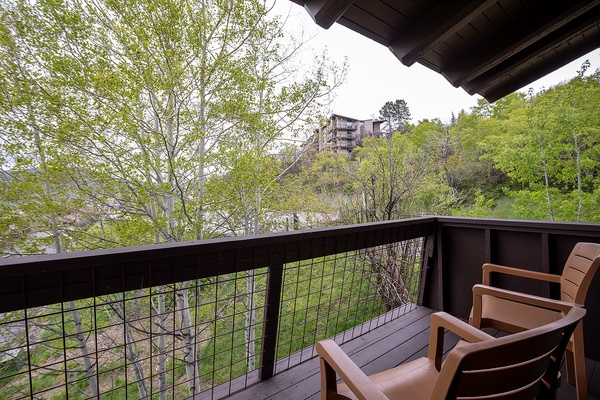 Step onto your private balcony and breathe in the crisp mountain air while surrounded by lush spring greenery and peaceful natural beauty.