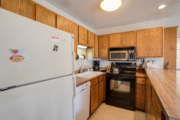 Your fully equipped kitchen has everything you need: a spacious refrigerator, stove with oven, microwave, dishwasher, and plenty of counter space to prepare your favorite meals during your stay.