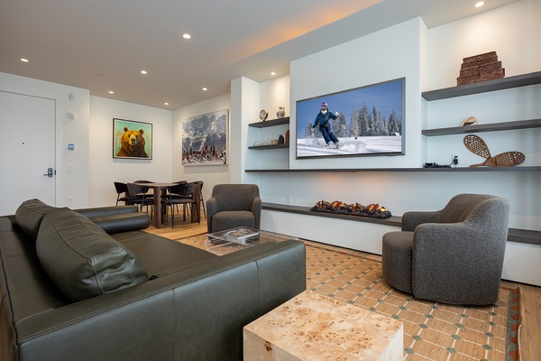 Unwind in your stylish living space, where modern comfort meets mountain charm. Plush seating, ambient lighting, and inviting décor create the perfect setting for relaxing after your day's adventures.