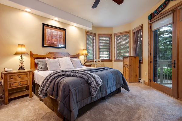 Drift off in your cozy mountain retreat, where warm wood tones and soft bedding invite deep relaxation. Step onto your private balcony for fresh alpine air.