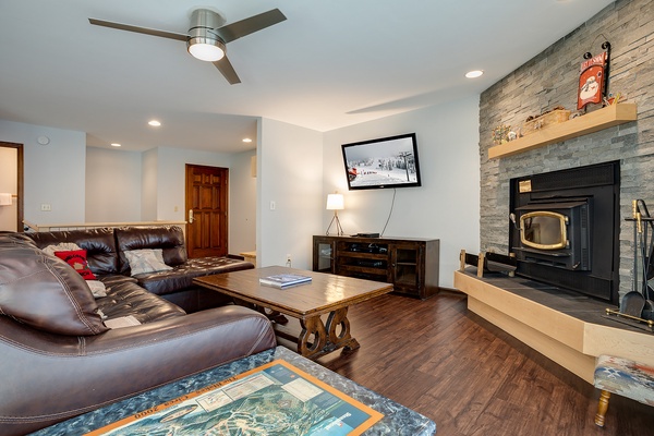 Sink into the plush leather couch and let your worries melt away by the cozy stone fireplace. Rich hardwood floors and thoughtful mountain-inspired touches create the perfect retreat after your adventures.