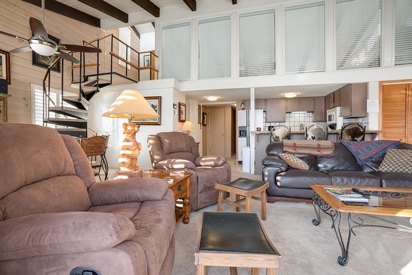 Unwind in your spacious loft with vaulted ceilings and plush seating. The open layout connects living, dining, and kitchen spaces for effortless group gatherings.