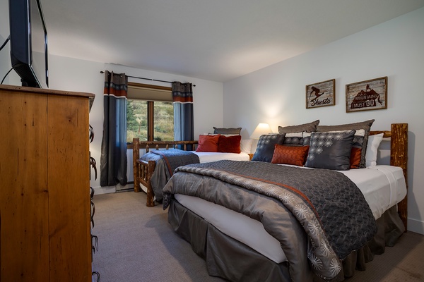 Drift off in your cozy retreat, where rustic charm meets mountain-lodge elegance. Two plush beds and peaceful views promise restful nights after your adventures.