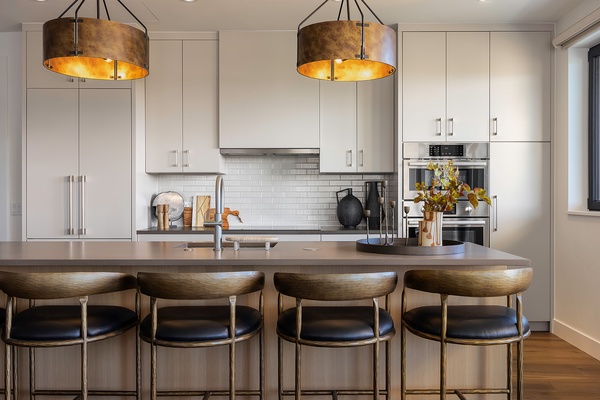Gather at your private island for casual meals or morning coffee. Sleek countertops, modern appliances, and designer lighting create a space where cooking feels effortless and stylish.