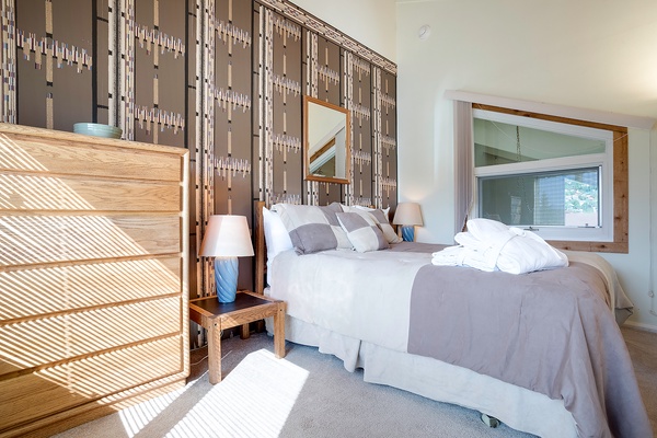 Slip into your tranquil retreat where soft linens and modern design create the perfect sanctuary for rest. Natural light fills the space, inviting you to unwind completely.