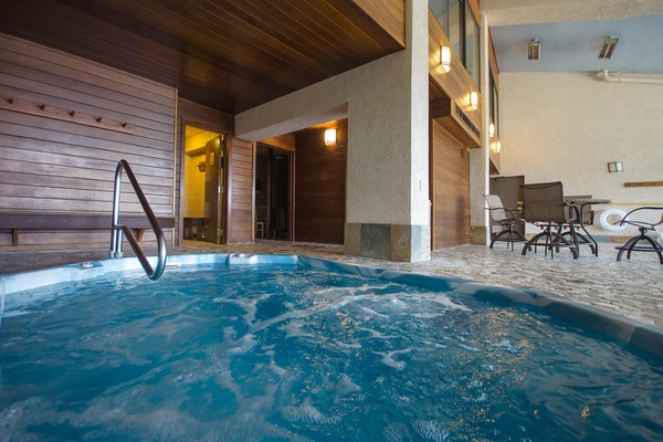 Slip into your private hot tub and let the warm, bubbling water melt away your cares under rich wood ceilings and soft ambient lighting.