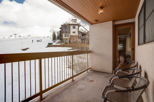 This private balcony provides ski slope views just steps from your door, with seating to enjoy crisp mountain air after a day on the runs.