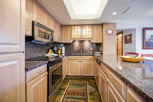 Your fully equipped kitchen features granite countertops, modern appliances, and plenty of prep space—perfect for creating memorable meals during your stay.