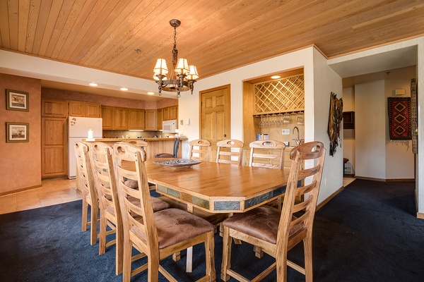 Gather around this spacious dining table with seating for eight, perfect for sharing meals and making memories together. The open-plan kitchen and elegant wood finishes create a warm, inviting atmosphere.