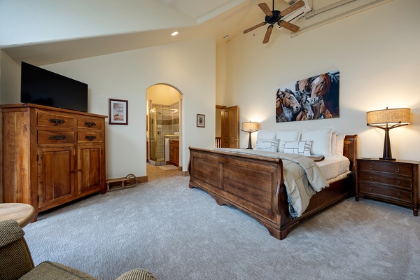 Sink into your peaceful bedroom retreat, with a plush bed, warm wood furnishings, and soft lighting that creates the perfect atmosphere for restful nights.