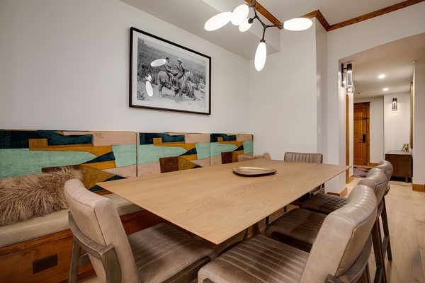 Your elegant dining space blends modern mountain style with plush seating, warm wood accents, and artistic touches—perfect for memorable meals and lively conversations.