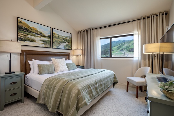 Wake up to stunning mountain vistas framed by soft linens and elegant decor. Your peaceful retreat offers cozy seating and serene views to unwind after a day of adventure.