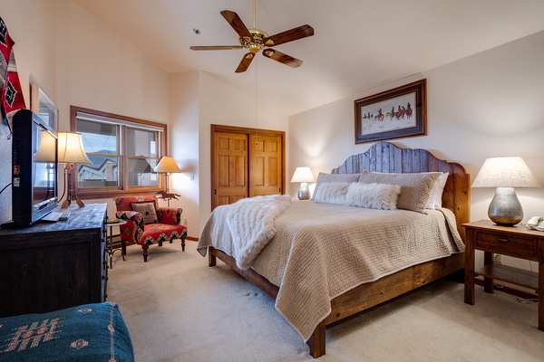 Slip into crisp, layered linens on your rustic wood bed, where vaulted ceilings and gentle lamplight create a peaceful retreat after a day exploring the mountains.