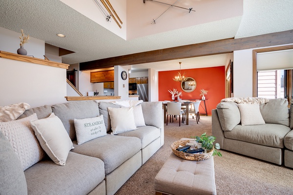 Your spacious open-concept retreat features soaring vaulted ceilings, plush seating, and warm wood accents that invite you to unwind and feel right at home.