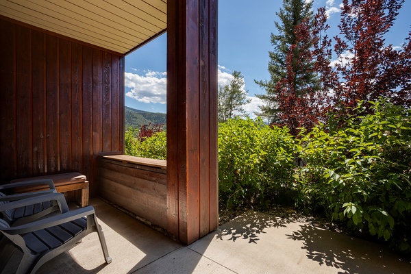 Step onto your private balcony and breathe in the fresh mountain air while soaking in stunning views of lush greenery and distant peaks—your perfect retreat awaits.