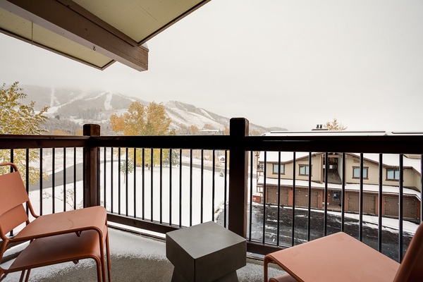Step out to your private covered balcony and take in peaceful views of the slopes, framed by autumn foliage and mountain peaks—perfect for morning coffee or evening relaxation.