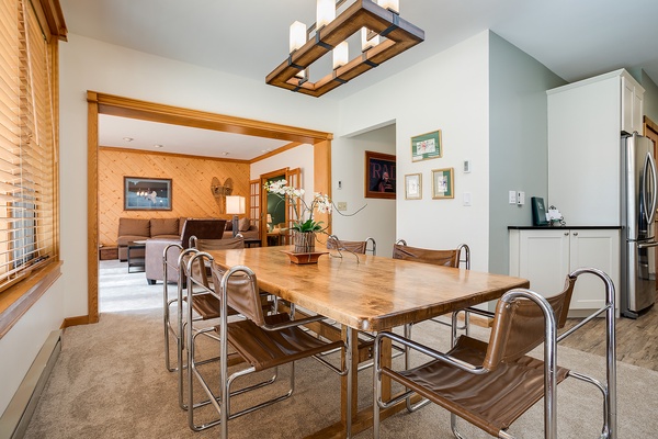 Gather around this stunning live-edge dining table, where warm wood tones and modern design create your perfect spot for memorable meals and conversations with loved ones.