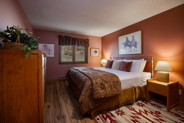Sink into your plush bed surrounded by warm earth tones and western charm. Soft lighting, tasteful artwork, and cozy textures create a peaceful retreat after your adventures.