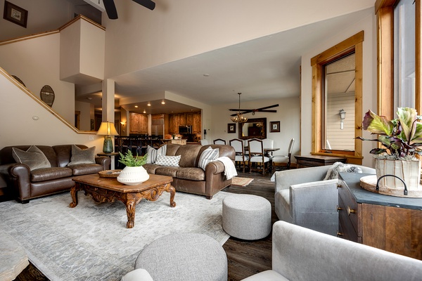 Sink into rich leather sofas and plush seating where rustic wood meets mountain elegance. Your open-concept retreat flows effortlessly from cozy living spaces to the gourmet kitchen—perfect for gathering and unwinding.