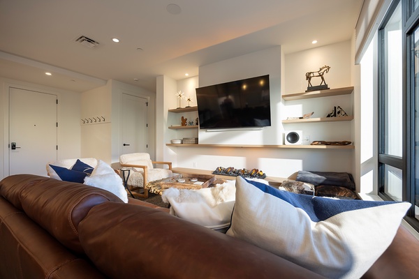 Sink into plush seating and let natural light fill your retreat. This inviting space blends warm textures, stylish décor, and modern comforts to help you truly unwind.