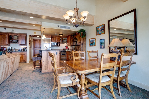 Gather around the elegant dining table where your group can share meals and stories, with a fully equipped kitchen ready for all your home-cooked favorites.