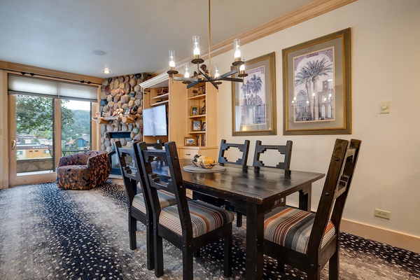 Gather around your private dining table beneath warm lighting, with cozy seating and charming décor welcoming you home after exploring the surrounding mountains.