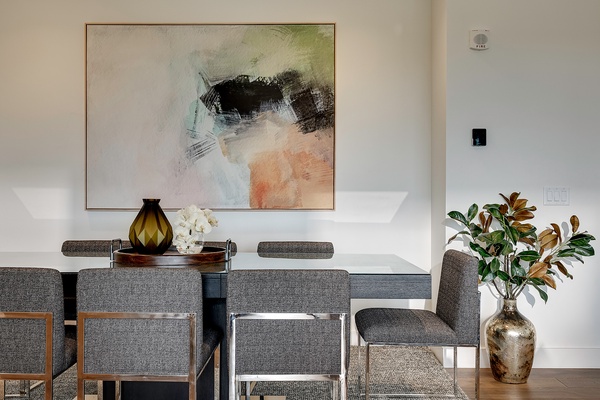 Your elegant dining space features modern furnishings and curated artwork, creating a sophisticated backdrop for memorable meals with loved ones.