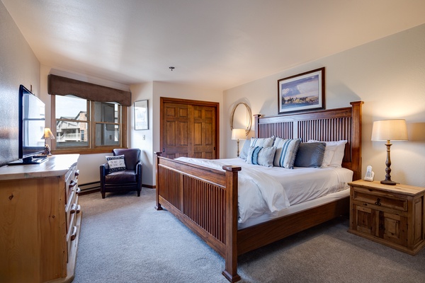 Slip into crisp linens and sink into plush pillows on your king-sized bed, with warm wood accents and mountain views welcoming you to unwind.
